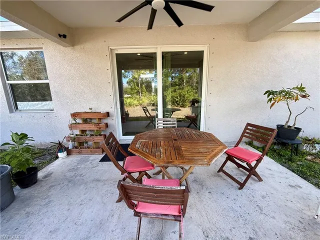 View of patio / terrace featuring outdoor dining space and a ceiling fan