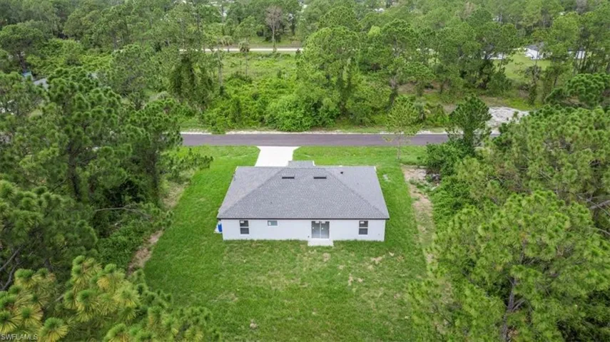 View from above of property with a forest