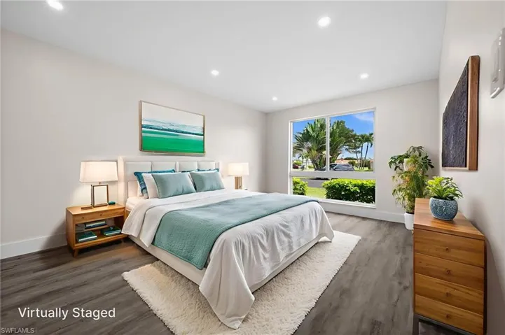 Bedroom with recessed lighting and dark wood finished floors