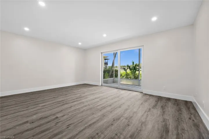 Empty room featuring recessed lighting and wood finished floors