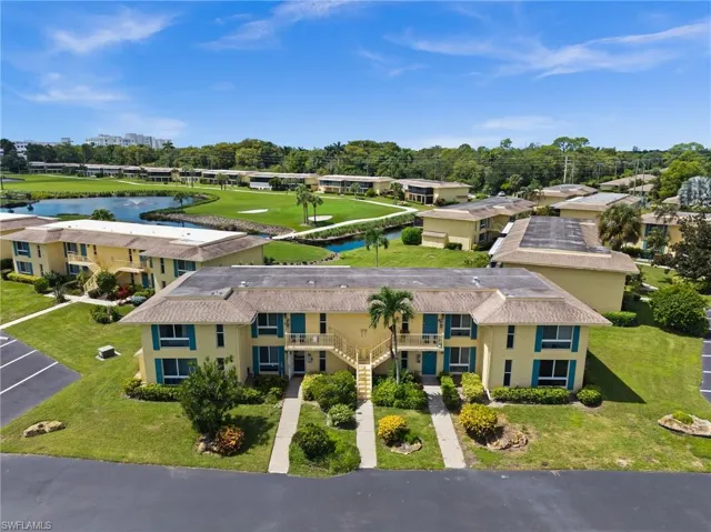 Bird's eye view of a nearby body of water and a local golf course