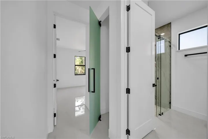 Hallway featuring baseboards