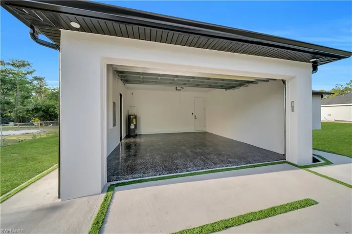 Garage featuring water heater