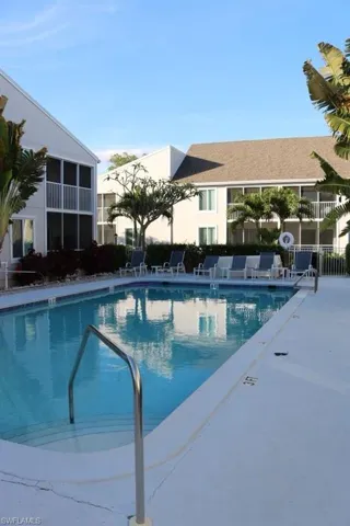 Outdoor swimming pool with integrated steps and a stainless steel handrail