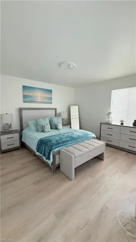 Light wood-finish flooring complements white walls and ceiling