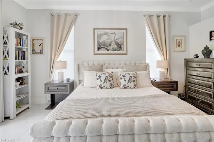Bedroom featuring ornamental molding and baseboards