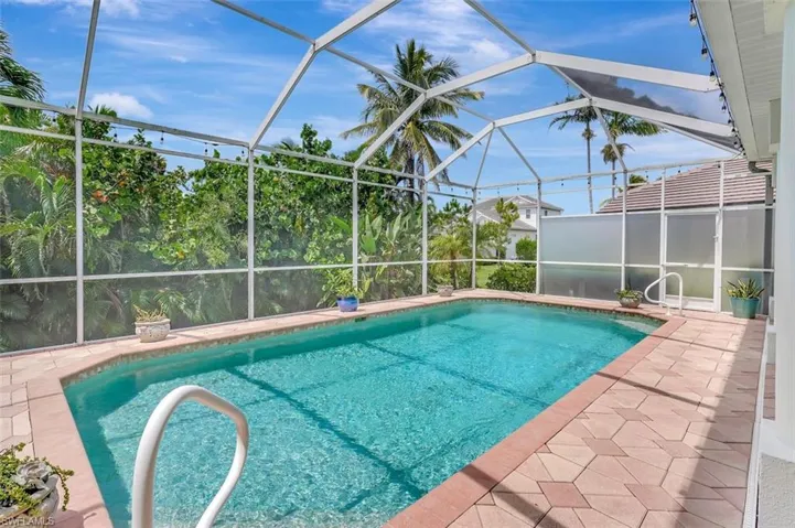Outdoor pool featuring a patio area and a lanai