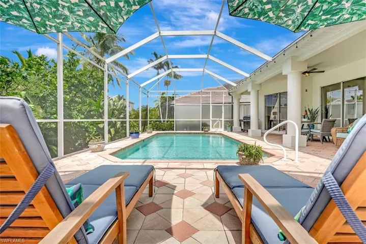 Swimming pool featuring a patio and a lanai