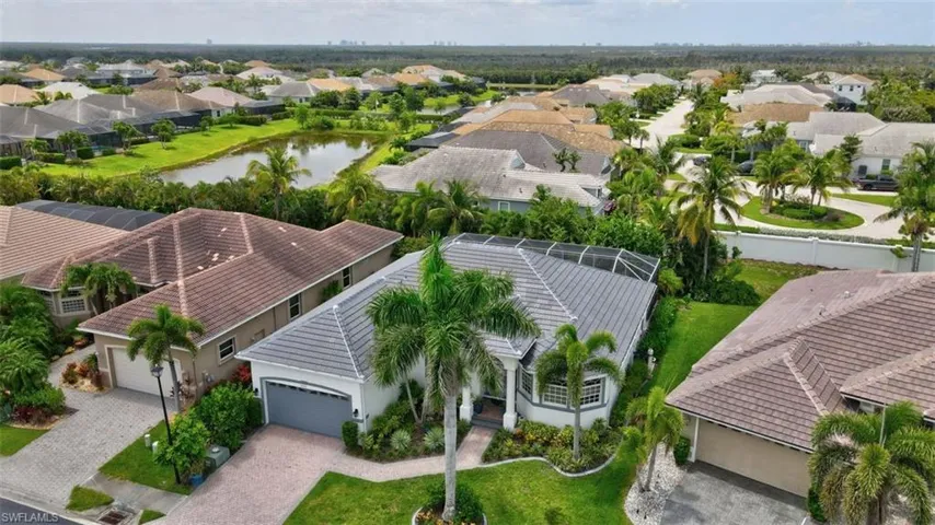 Aerial perspective of suburban area with a nearby body of water
