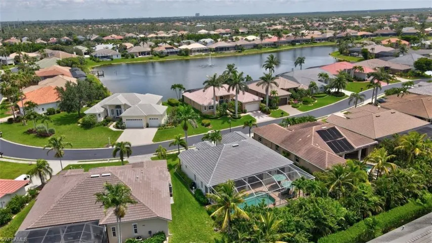 Aerial perspective of suburban area with a large body of water