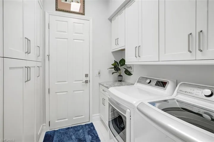 Washroom with independent washer and dryer and cabinet space