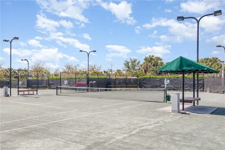 View of tennis court with fence