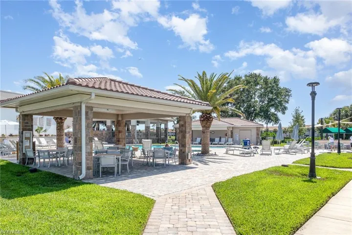 Surrounding community with a lawn, a gazebo, a pool, and a patio area