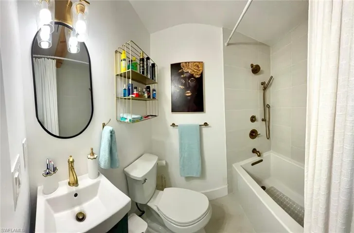 Full bathroom with vanity and shower / tub combo