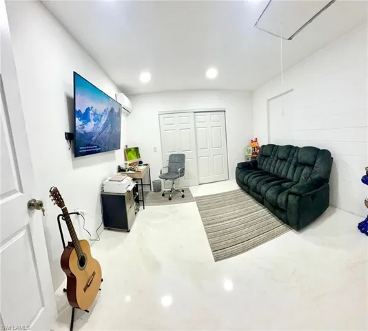 Office featuring concrete floors and recessed lighting