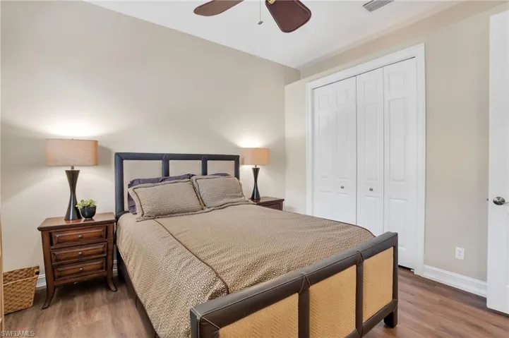 Bedroom featuring a closet, wood finished floors, and ceiling fan