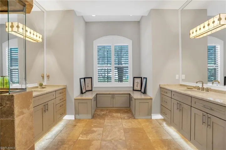 Full bath featuring two vanities and recessed lighting