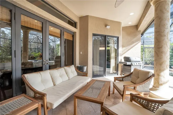 View of patio / terrace with french doors, an outdoor hangout area, grilling area, and a lanai