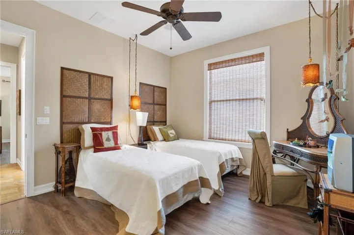 Bedroom featuring wood finished floors and a ceiling fan