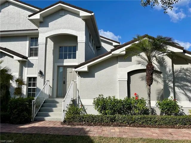View of front of house featuring stucco siding