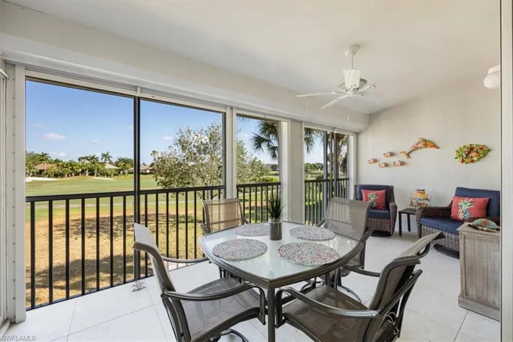 Sunroom / solarium with outdoor dining area, ceiling fan, an outdoor living space, and golf course view