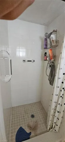 Bathroom featuring a shower with curtain