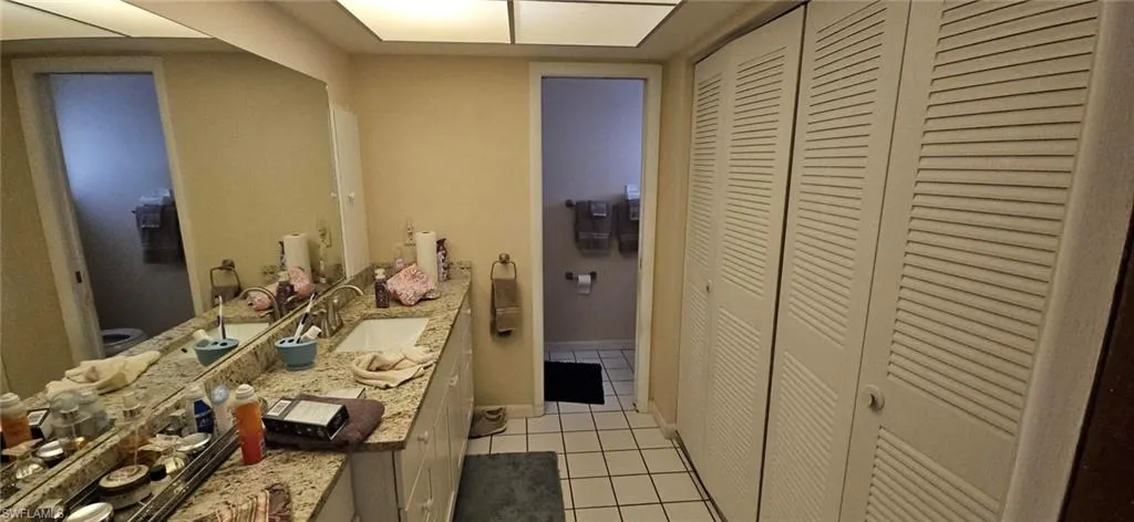Bathroom featuring tile patterned floors and vanity