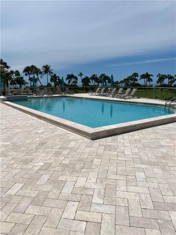 Community pool featuring a patio area