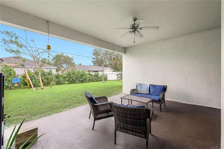 View of patio / terrace with a fenced backyard and a ceiling fan