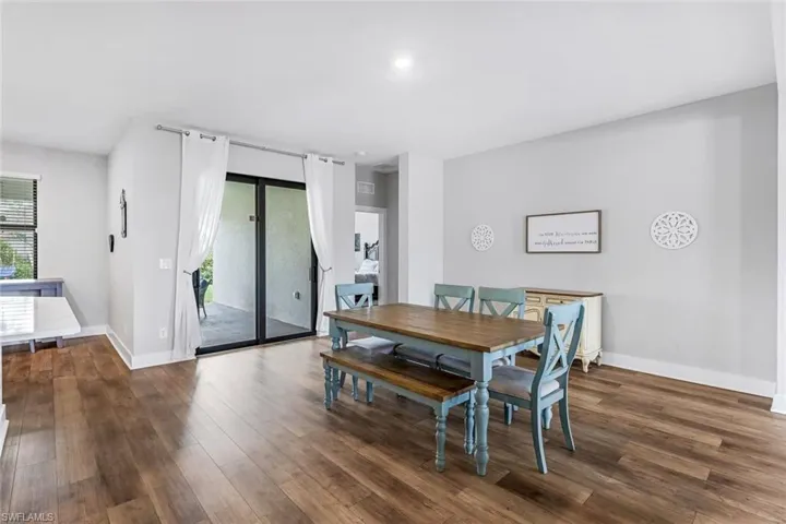 Dining space featuring baseboards and wood finished floors