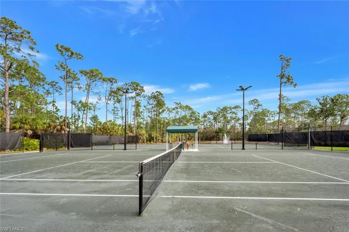 View of tennis court with community basketball court