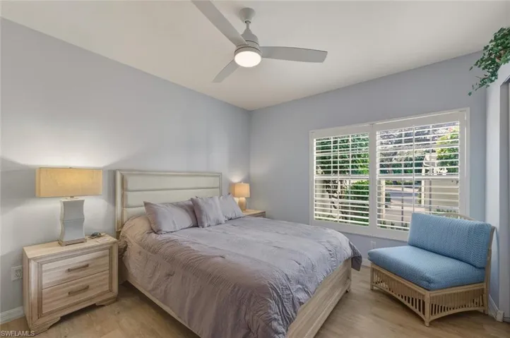 Bedroom featuring light wood-type flooring and ceiling fan