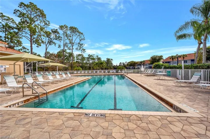 Community pool with a patio area