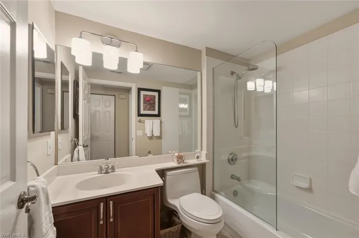 Bathroom with vanity and  shower combination