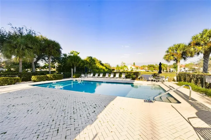 Community pool featuring a patio area