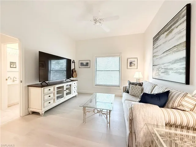Den has new luxury vinyl plank floor and side window for additional light