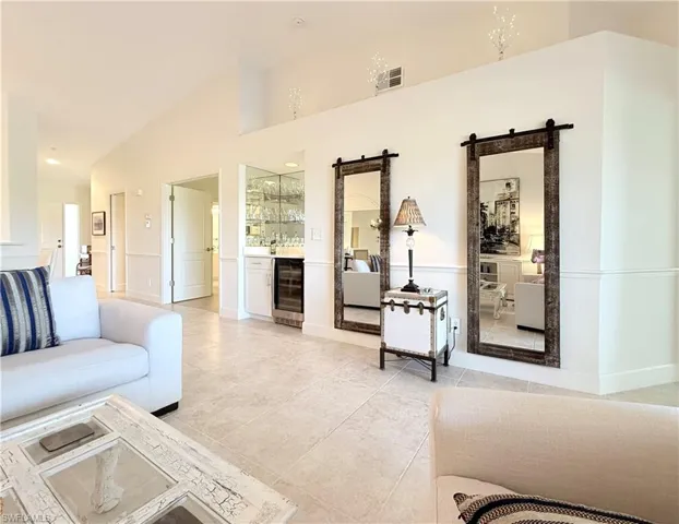 Off main living room you will find bar and additional den
