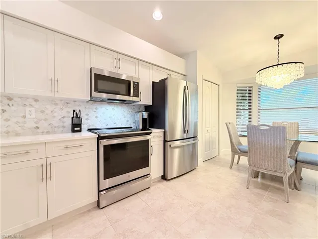 New SS Appliances, Shaker cabinets, quartz counter tops, custom tile back splash