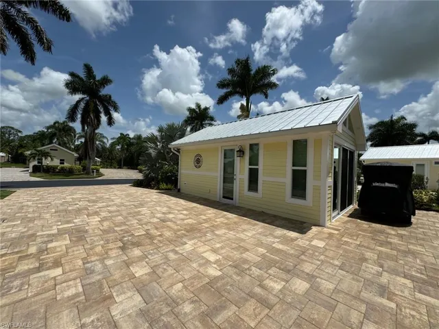 Rear view of property featuring a patio