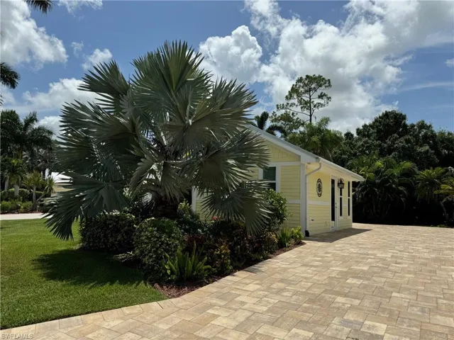 View of home's exterior with a yard