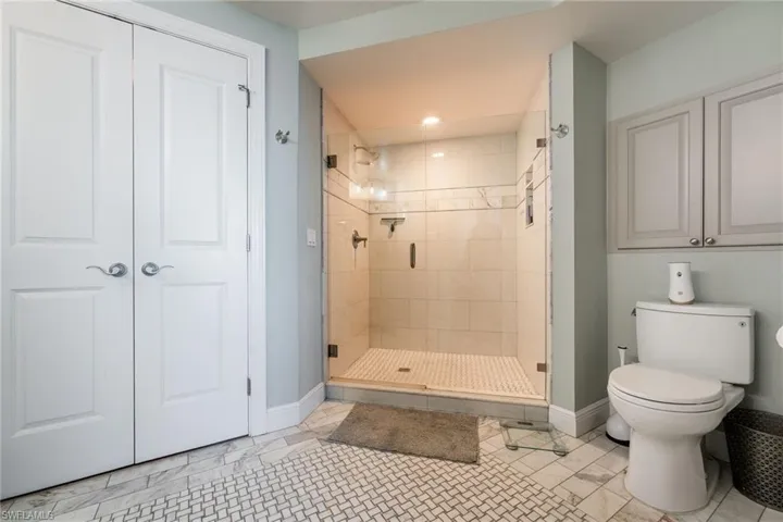 Bathroom with toilet and walk in shower