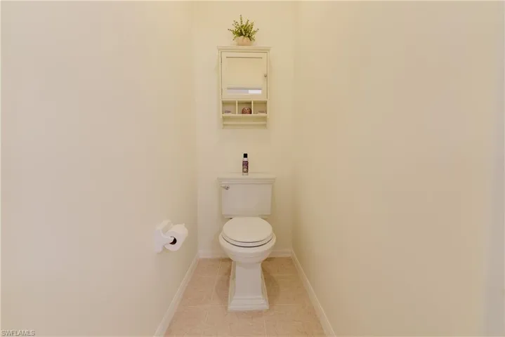 Bathroom featuring tile patterned floors and toilet