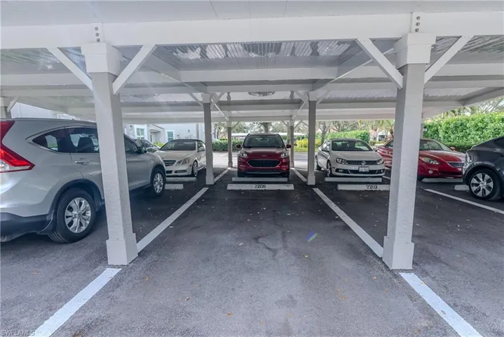 View of vehicle parking with a carport