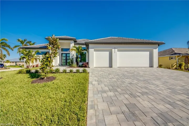 Prairie-style house with a front yard and a garage