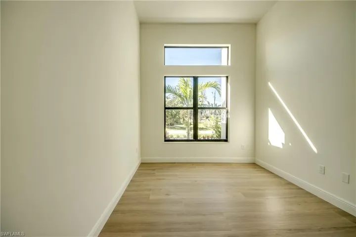 Unfurnished room with light wood-type flooring