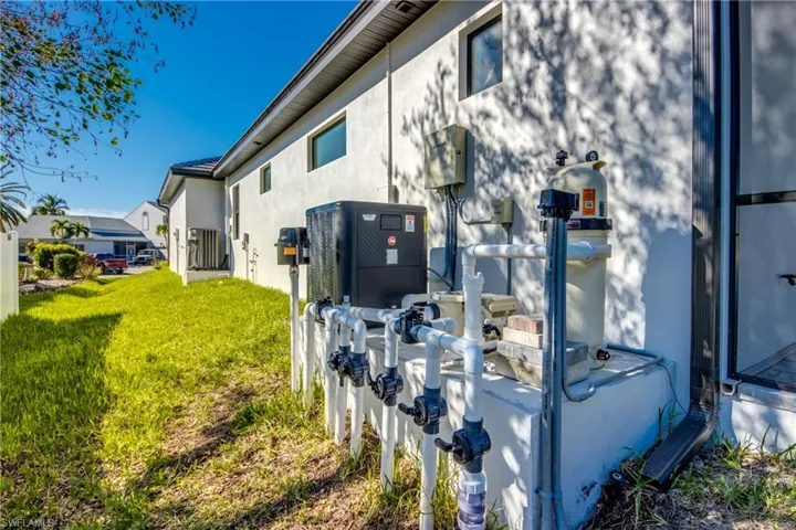 View of side of property featuring a yard
