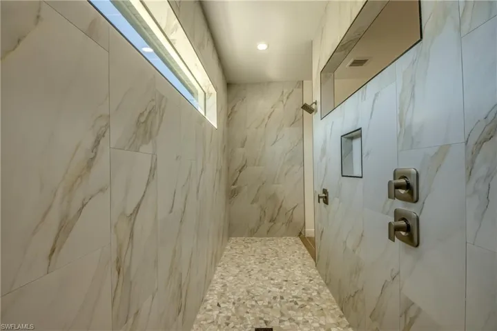 Bathroom with a tile shower