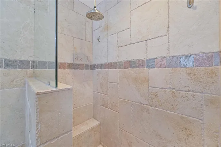 Full bath featuring a tile shower