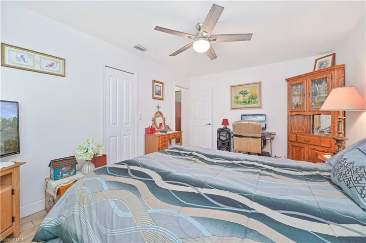 Bedroom with a closet and a ceiling fan