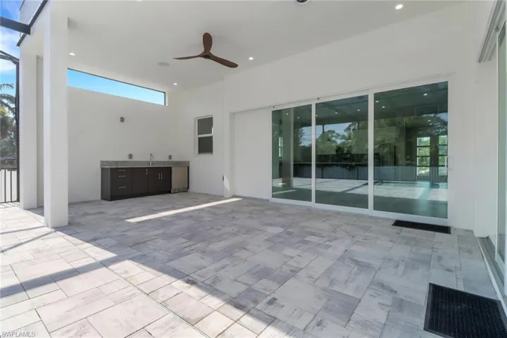 View of patio featuring a ceiling fan
